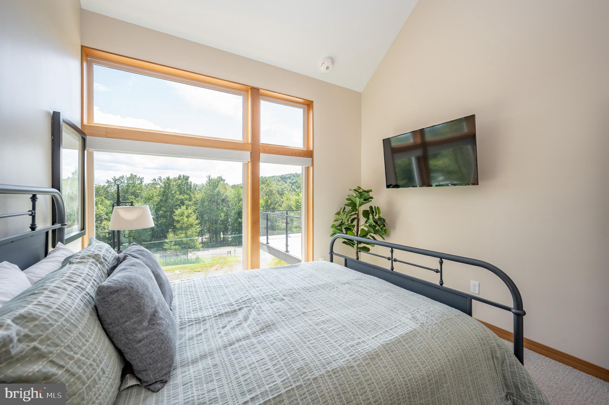 2614 Marsh Hill Road McHenry, MD 21541 - Photo 28 of 76 a bedroom with a bed and a large window