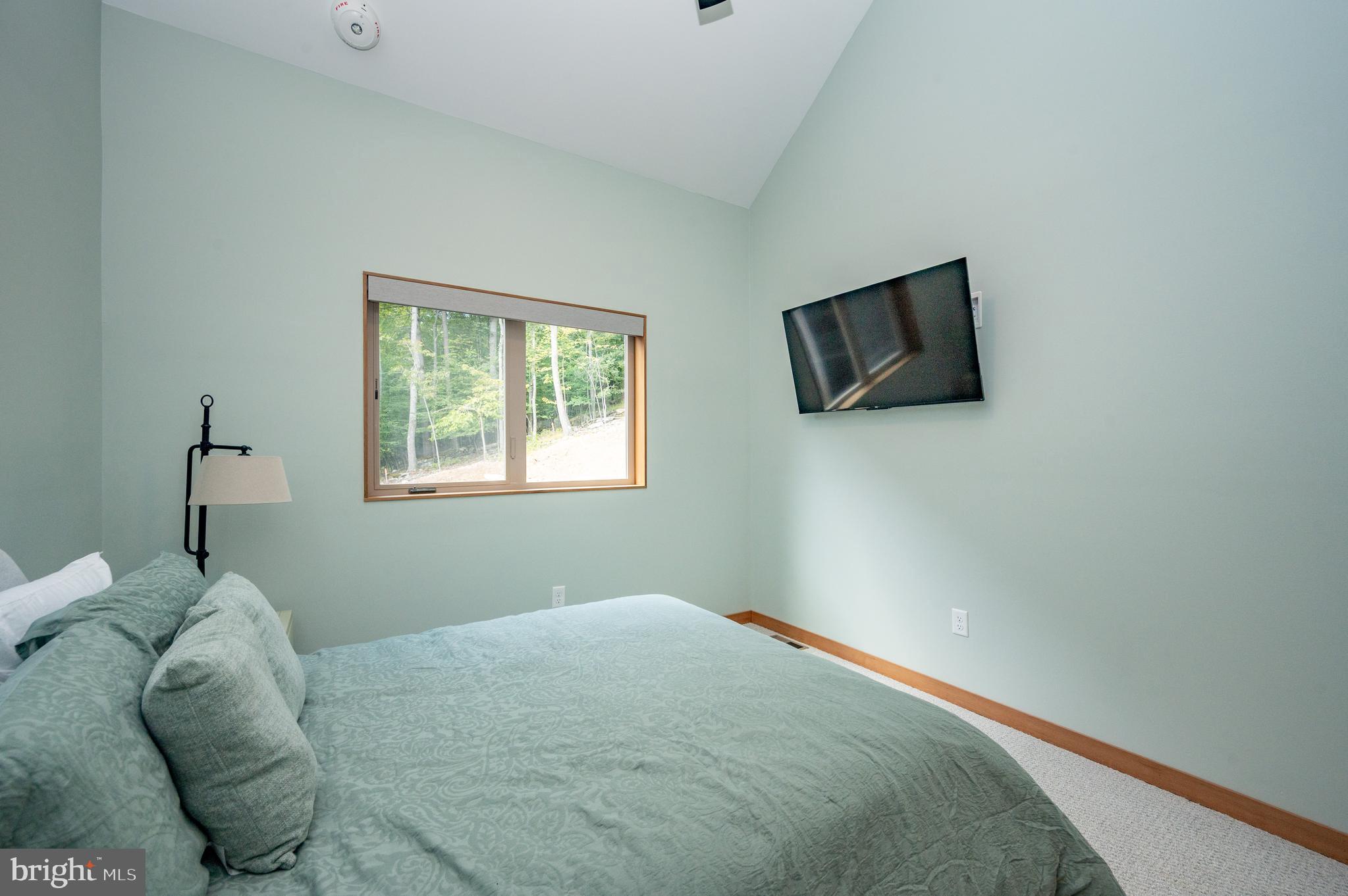 2614 Marsh Hill Road McHenry, MD 21541 - Photo 30 of 76 a bedroom with a bed and a window