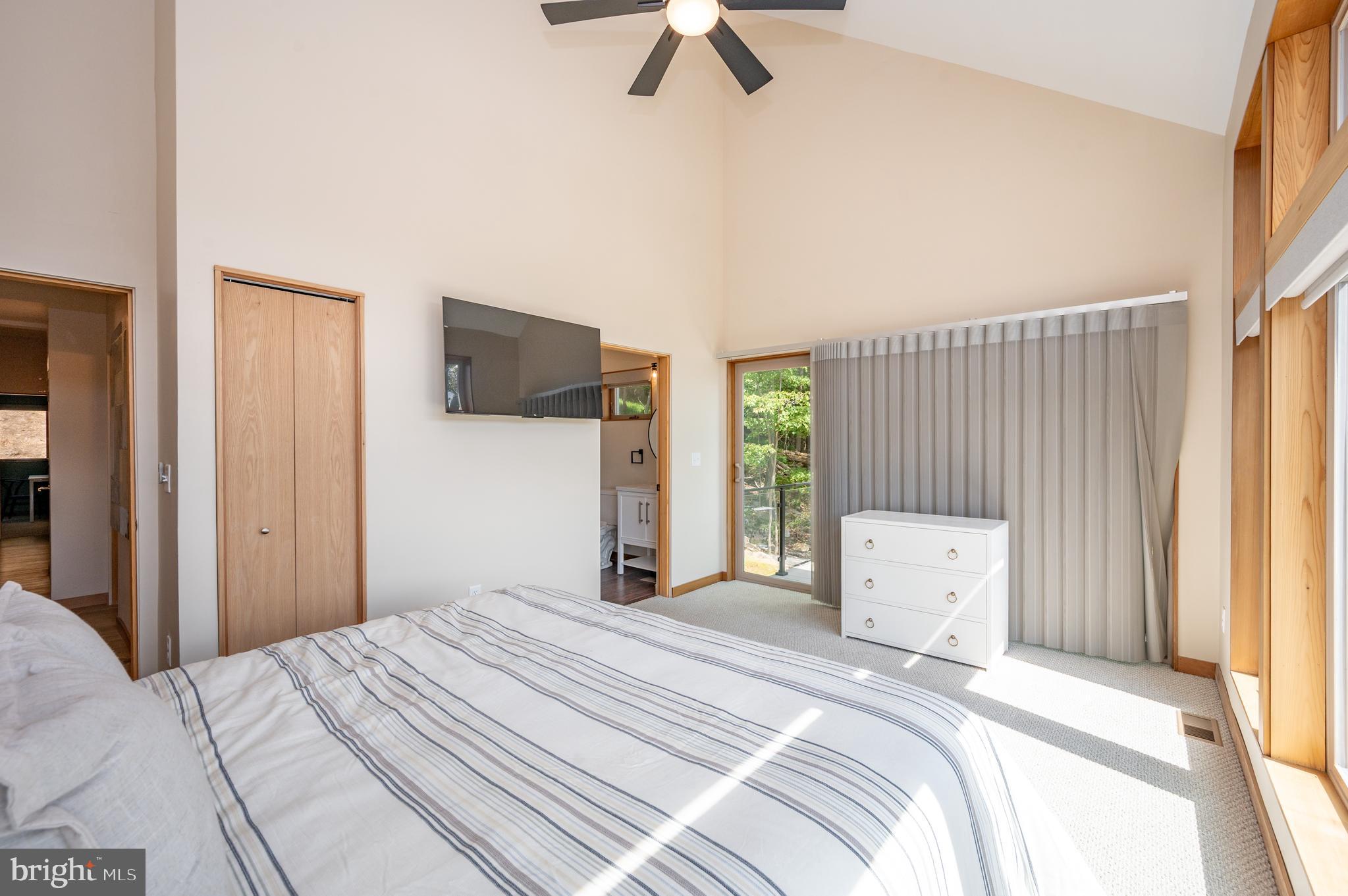 2614 Marsh Hill Road McHenry, MD 21541 - Photo 33 of 76 a bedroom with a bed and a large window