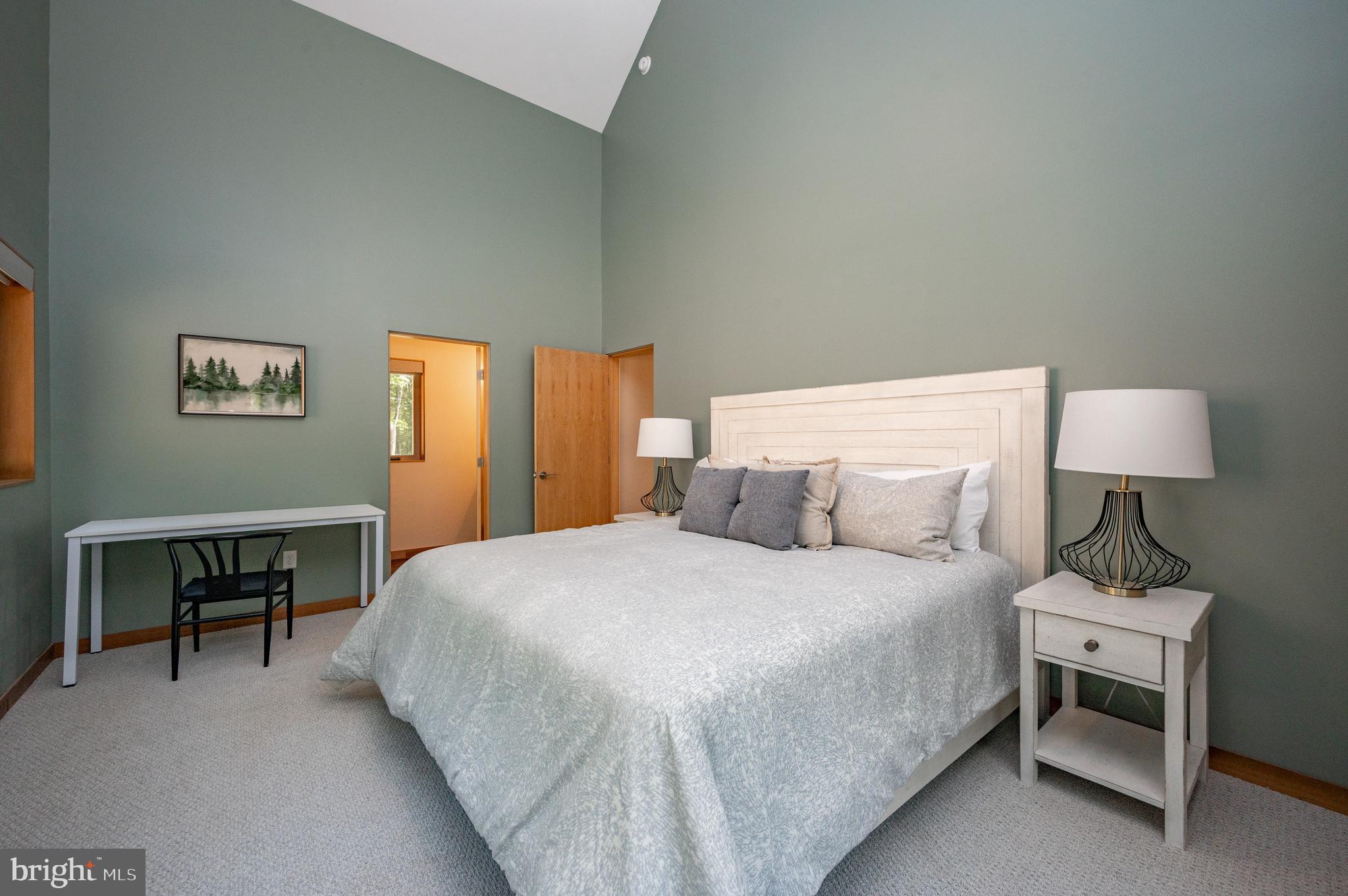 2614 Marsh Hill Road McHenry, MD 21541 - Photo 39 of 76 a bedroom with a bed table lamp and a window