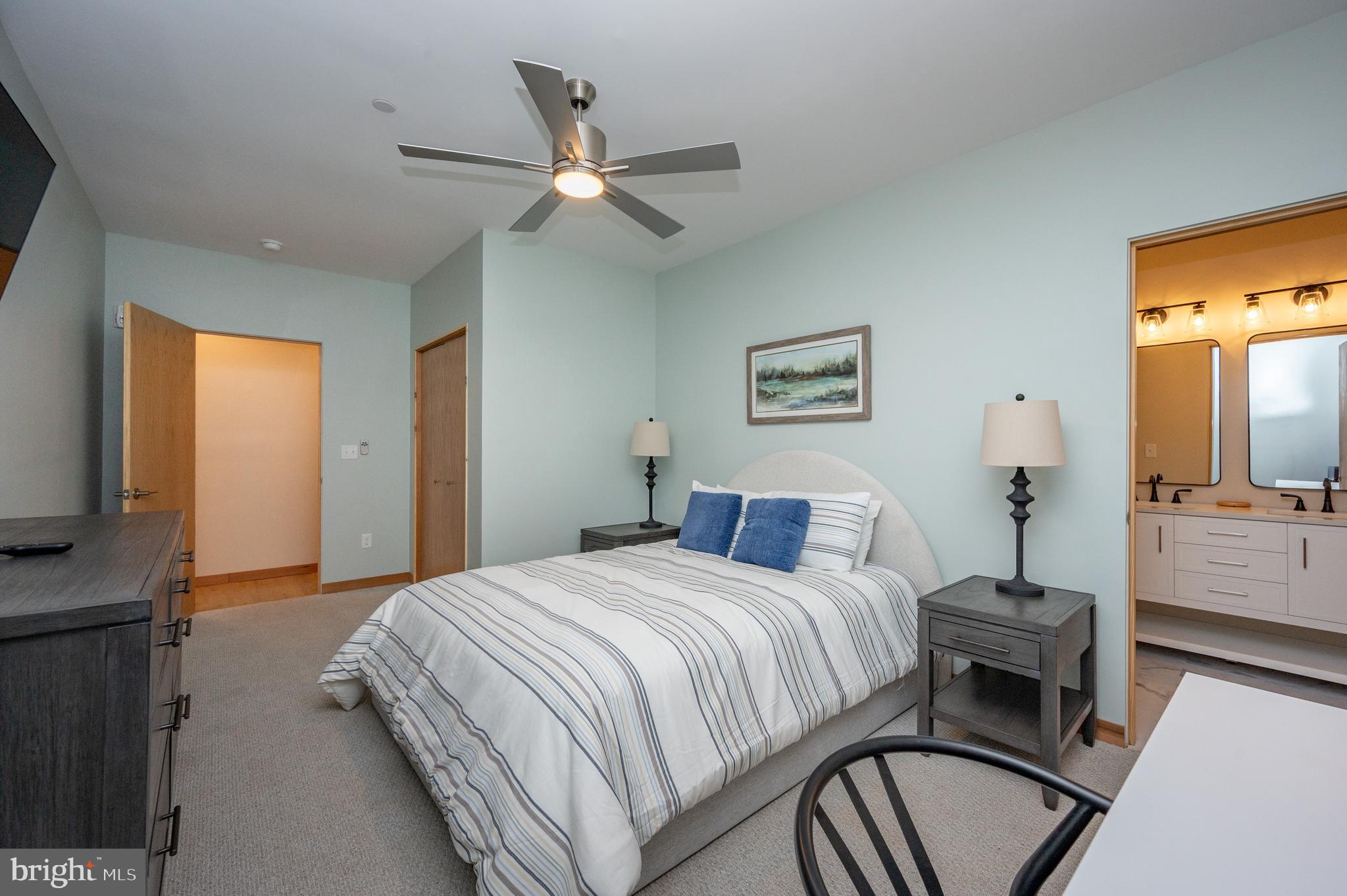 2614 Marsh Hill Road McHenry, MD 21541 - Photo 48 of 76 a bedroom with a bed and a chandelier