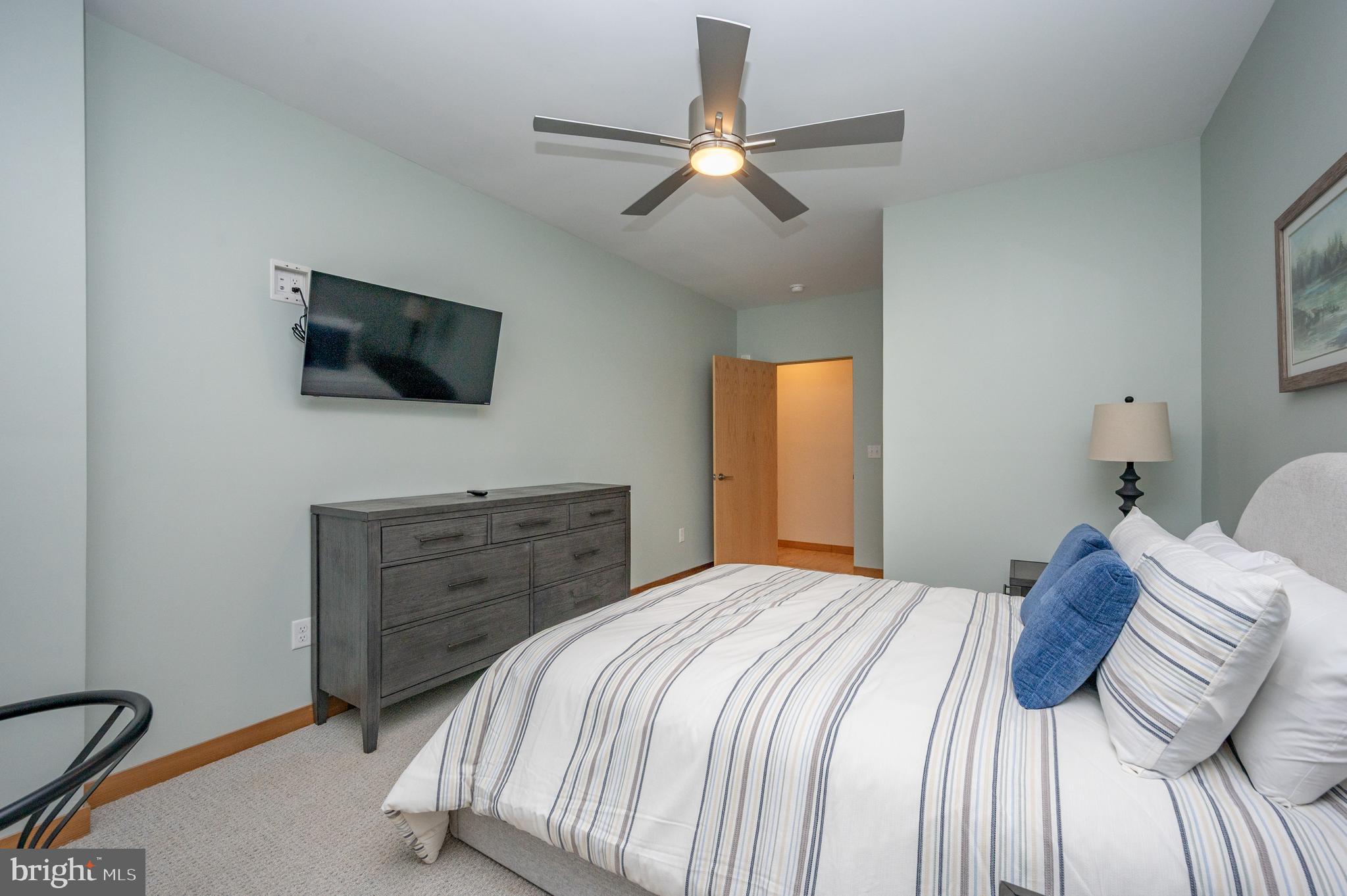 2614 Marsh Hill Road McHenry, MD 21541 - Photo 49 of 76 a bedroom with a bed and a flat screen tv