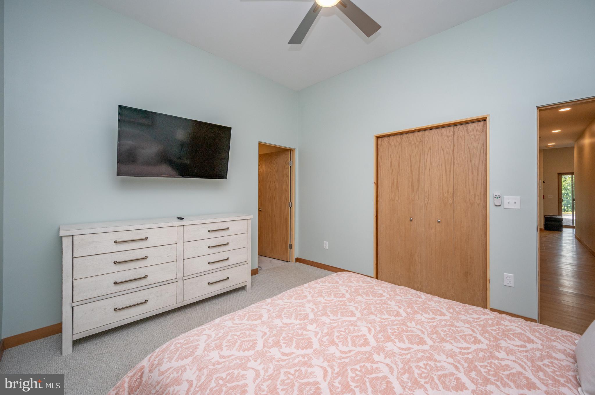 2614 Marsh Hill Road McHenry, MD 21541 - Photo 54 of 76 a room with a bed and a flat screen tv in a room