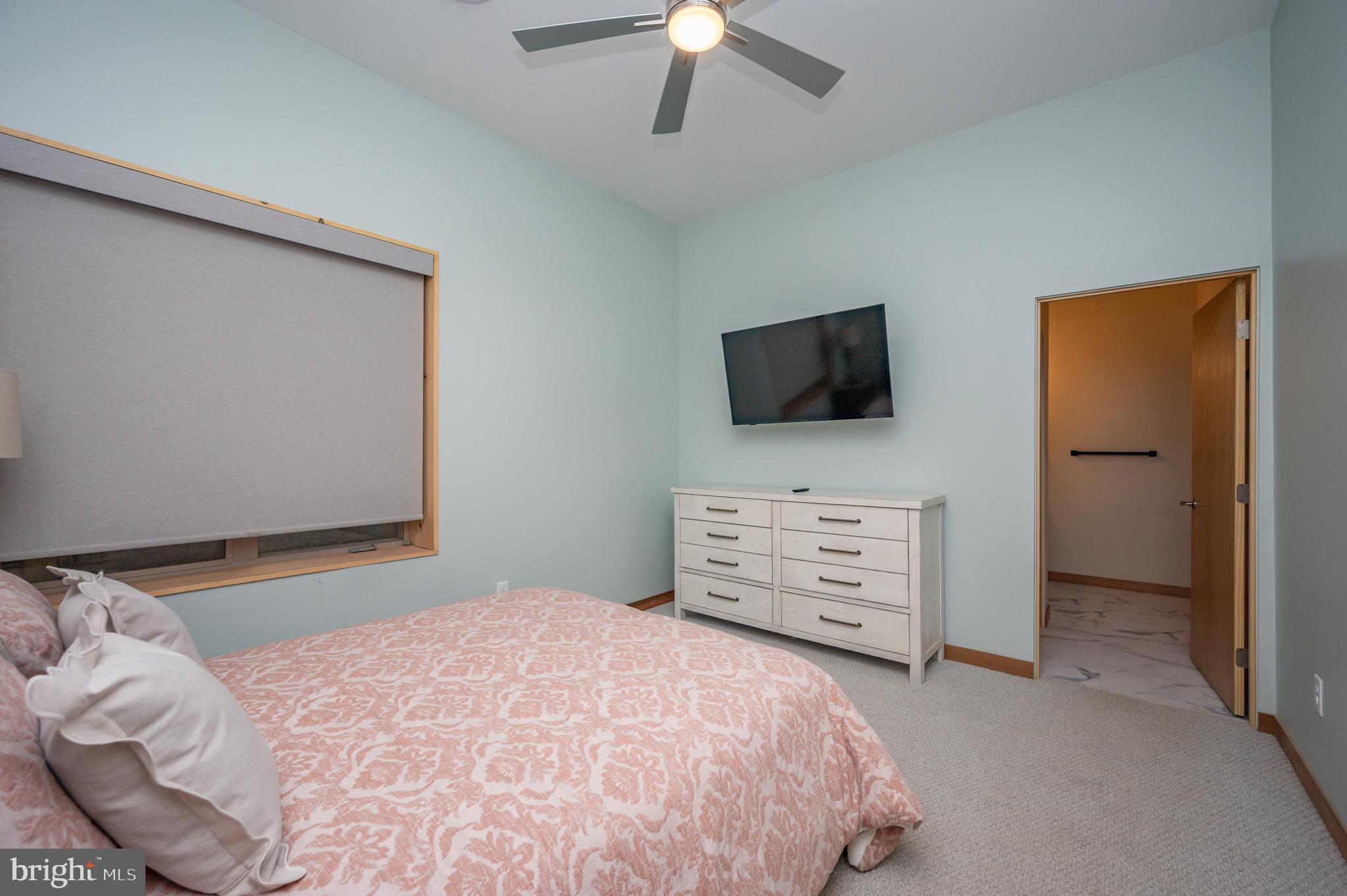 2614 Marsh Hill Road McHenry, MD 21541 - Photo 56 of 76 a bedroom with a bed and a flat screen tv
