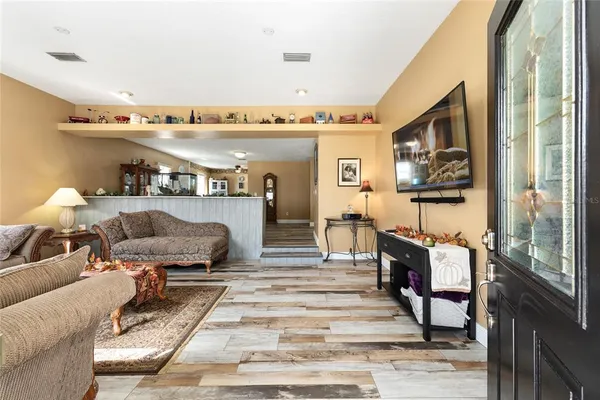 a living room with furniture and a rug