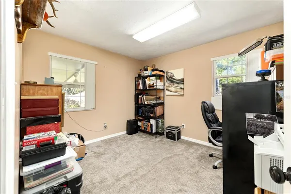 a view of a workspace with furniture and toys