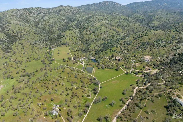 a view of a patio with table and chairs and wooden floor