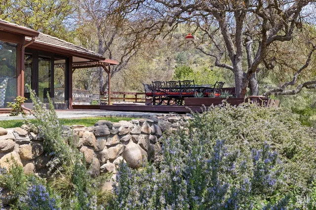 a living room with furniture a fireplace and a table
