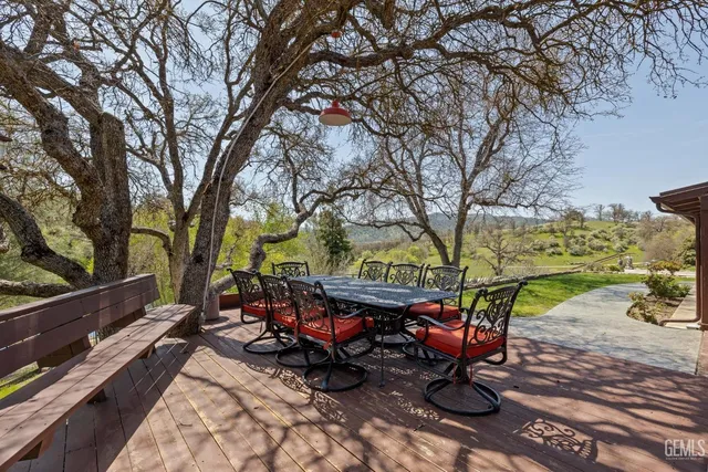 a living room with furniture a fireplace and a table