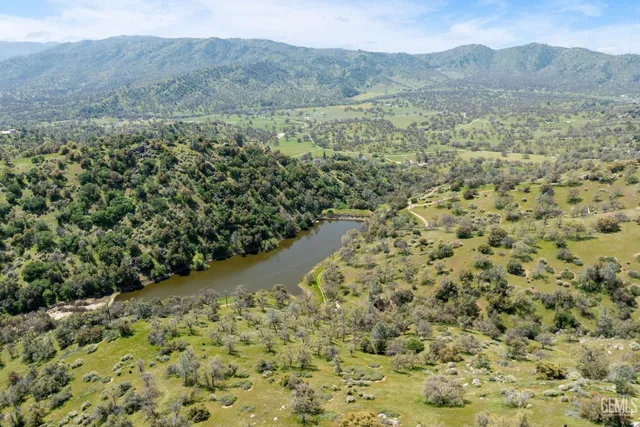 a kitchen with kitchen island a sink table and chairs