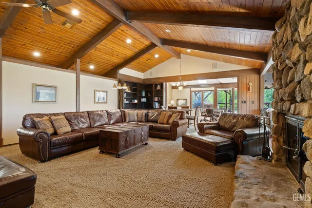 a spacious bathroom with a granite countertop sink and a mirror