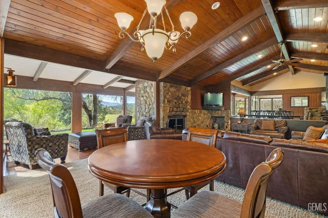 a front view of a house with a garden and trees