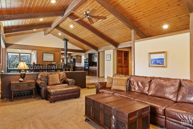 a bathroom with a granite countertop sink toilet a mirror and shower