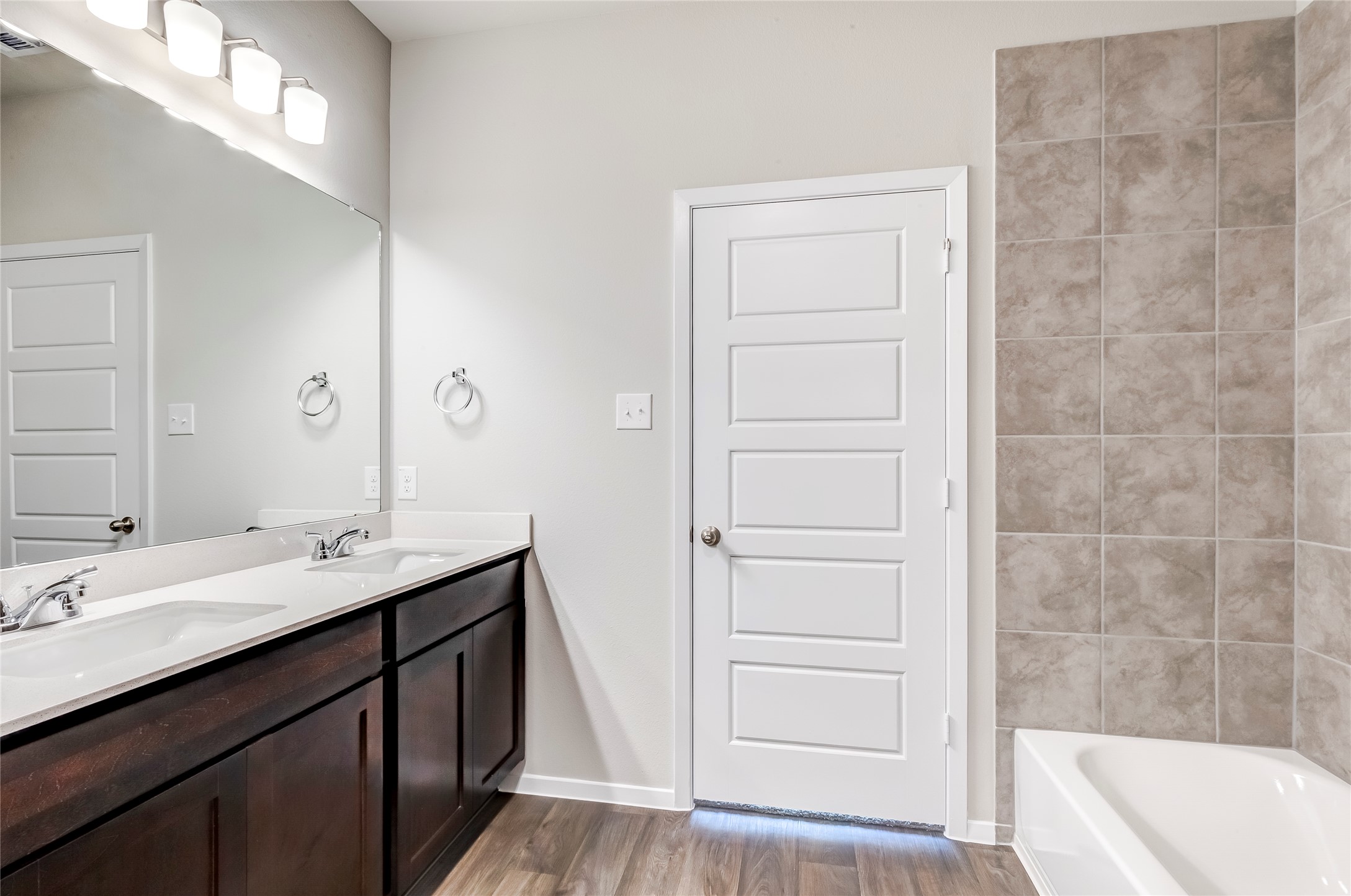 274 Jade Street Maxwell, TX 78656 - Photo 12 of 36 a bathroom with a sink a tub and a mirror