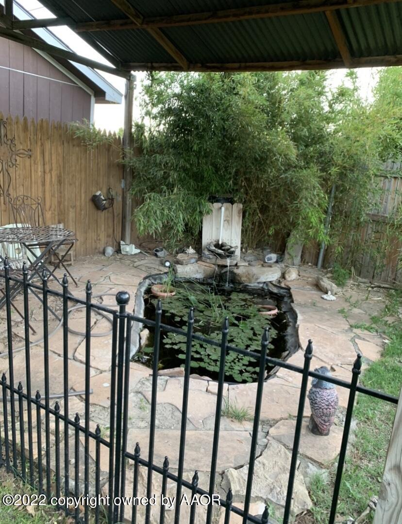 8104 Marni Trail Amarillo, TX 79110 - Photo 25 of 35 Backyard Pond