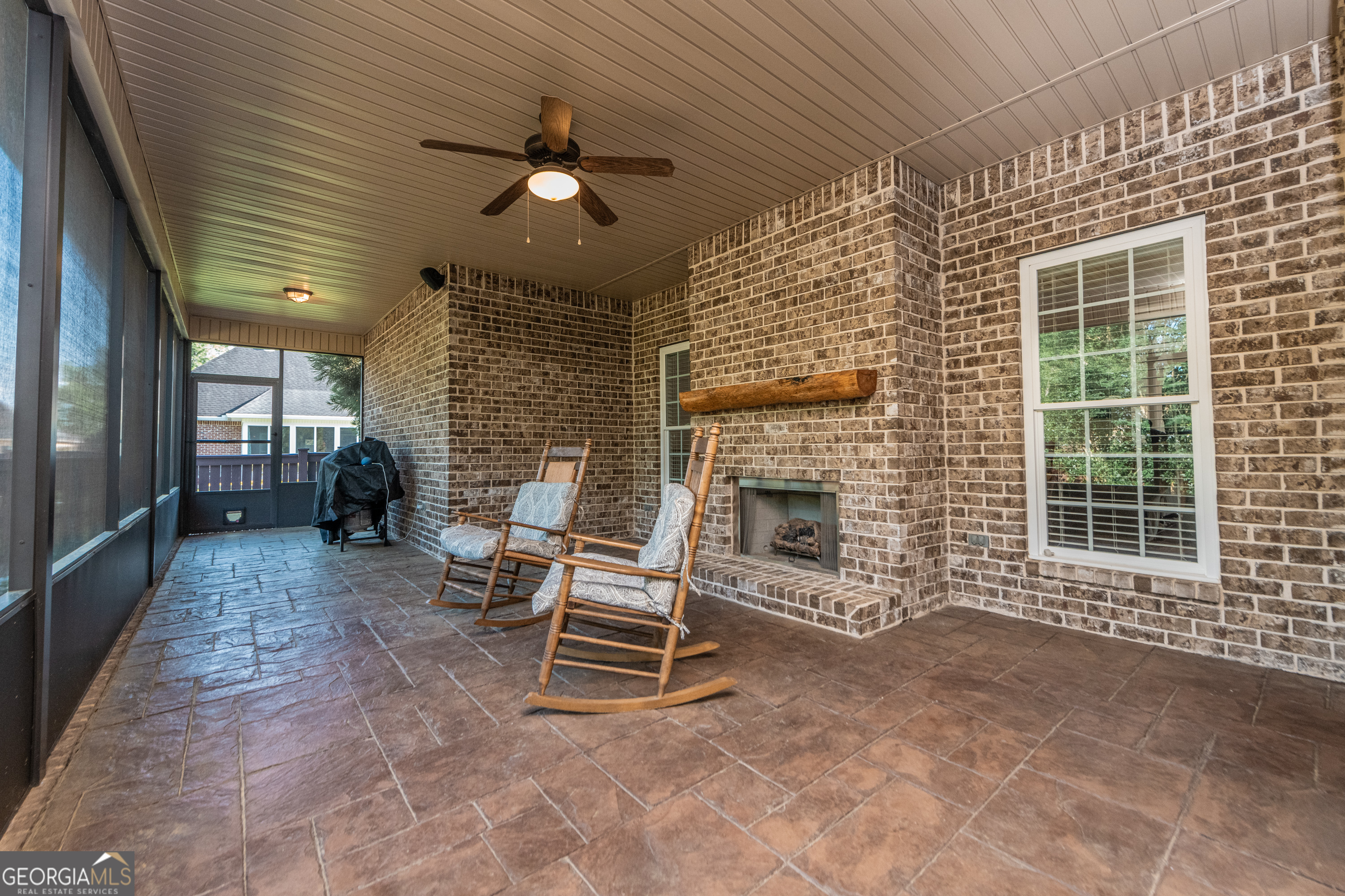 405 Old Bridge Road Warner Robins, GA 31088 - Photo 48 of 55 a view of a livingroom with a chair and a fireplace