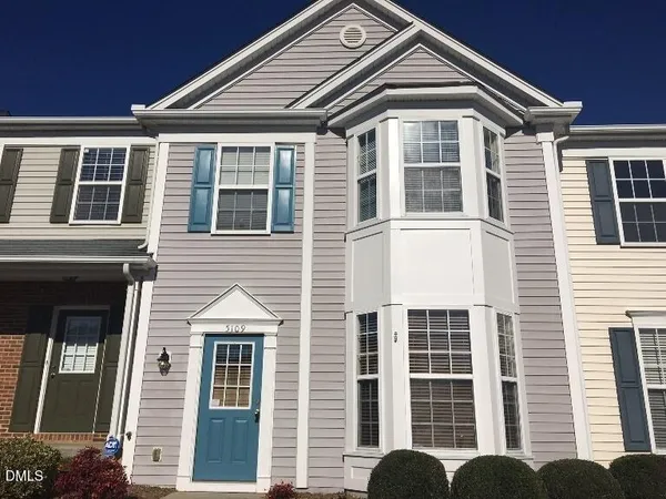 a front view of a house and a large windows