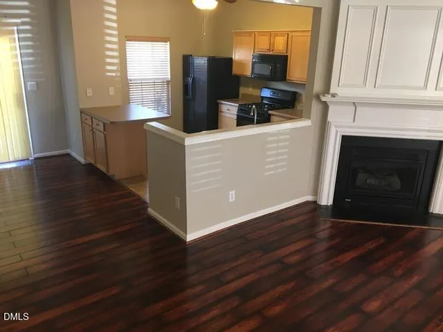 a kitchen with stainless steel appliances a refrigerator stove and sink