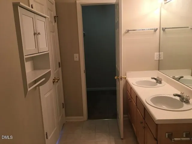 a bathroom with a sink and a washing machine
