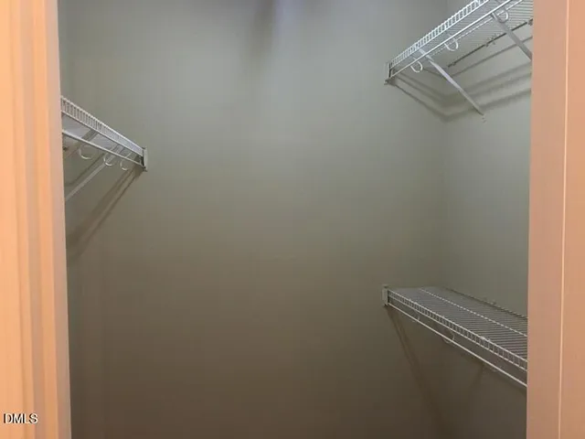 a view of a room with racks on the wall