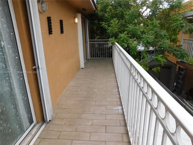 a view of a house with a small yard