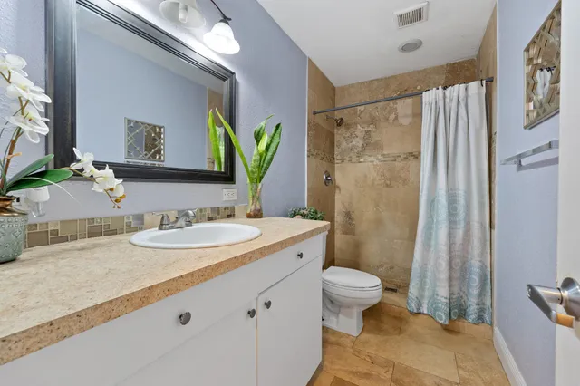 an aerial view of multiple houses with yard