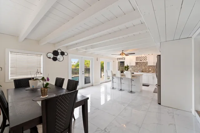 a bedroom with a bed and a computer on the desk