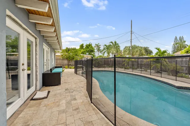 a bathroom with a sink a mirror and shower
