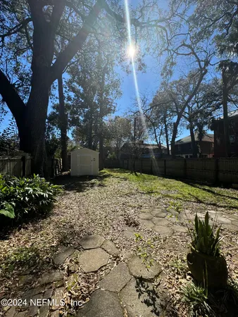 a view of a backyard with green space
