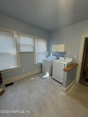 a room with a bed and a window