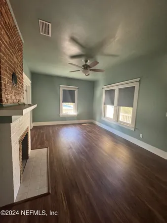 a view of livingroom with furniture and a fireplace