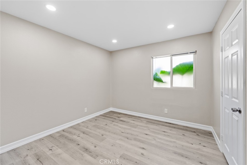 212 South Kraemer Boulevard, Unit 709 Placentia, CA 92870 - Photo 15 of 32 an empty room with wooden floor and window