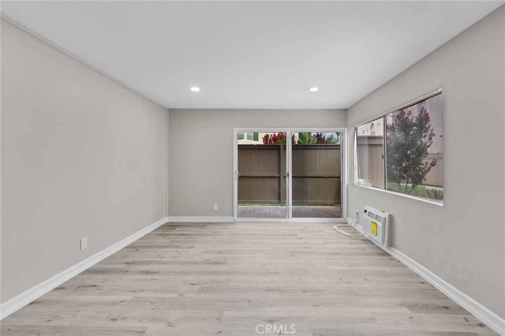 212 South Kraemer Boulevard, Unit 709 Placentia, CA 92870 - Photo 5 of 32 a view of an empty room with a window and wooden floor