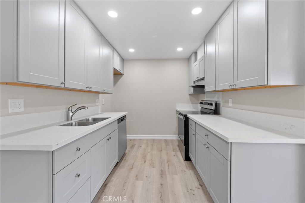 212 South Kraemer Boulevard, Unit 709 Placentia, CA 92870 - Photo 9 of 32 a kitchen with granite countertop a sink and cabinets