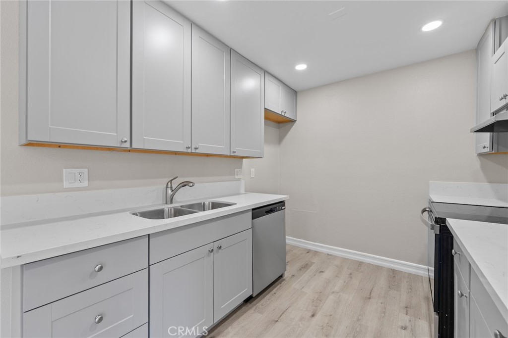 212 South Kraemer Boulevard, Unit 709 Placentia, CA 92870 - Photo 10 of 32 a kitchen with a sink cabinets and window
