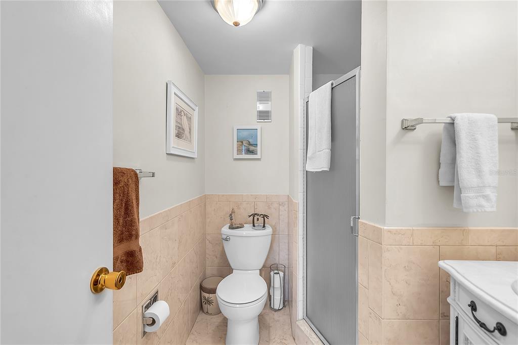 12200 Vonn Road, Unit 2206 Largo, FL 33774 - Photo 49 of 60 a bathroom with a toilet and a shower