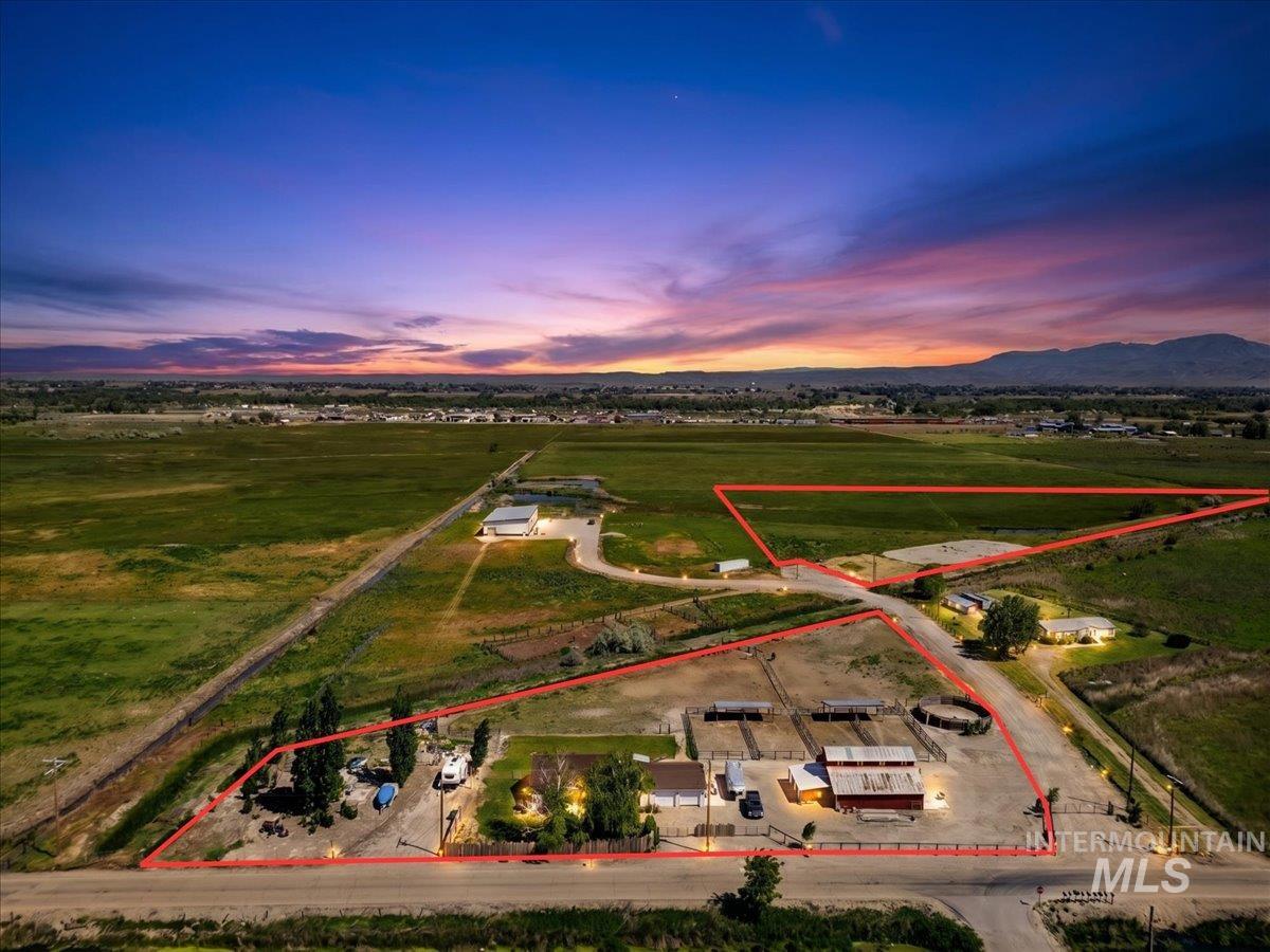 2588 West Sales Yard Road Emmett, ID 83617 - Photo 1 of 49 Expansive acreage featuring multiple structures, including a primary residence, a barn, and several outbuildings