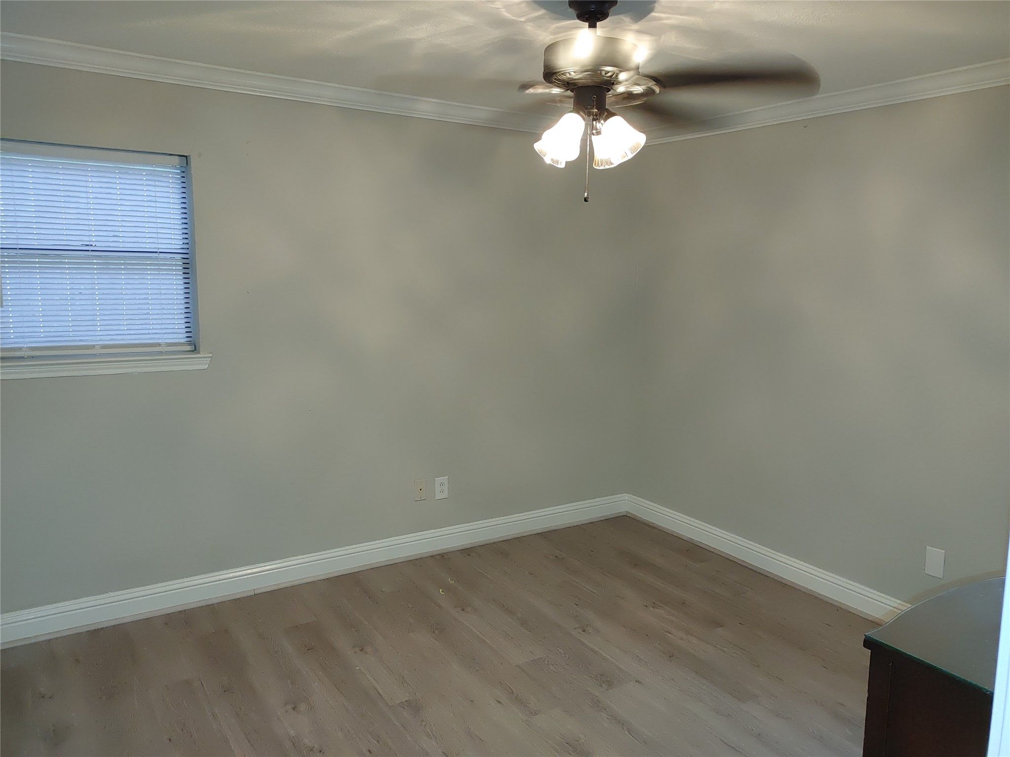 6204 Culberson Street, Unit 12 Houston, TX 77021 - Photo 3 of 6 a view of a small space with wooden floor and a window