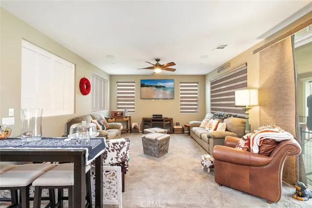 a very nice looking living room with furniture and a window