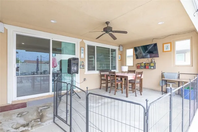 a dining room with furniture and window