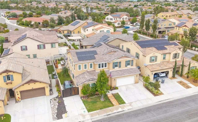 an aerial view of residential houses with outdoor space