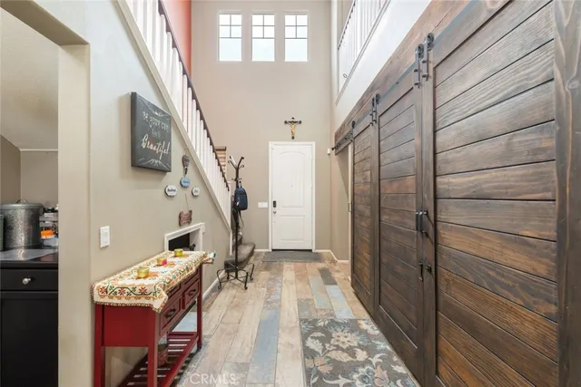 a view of an entryway with wooden floor
