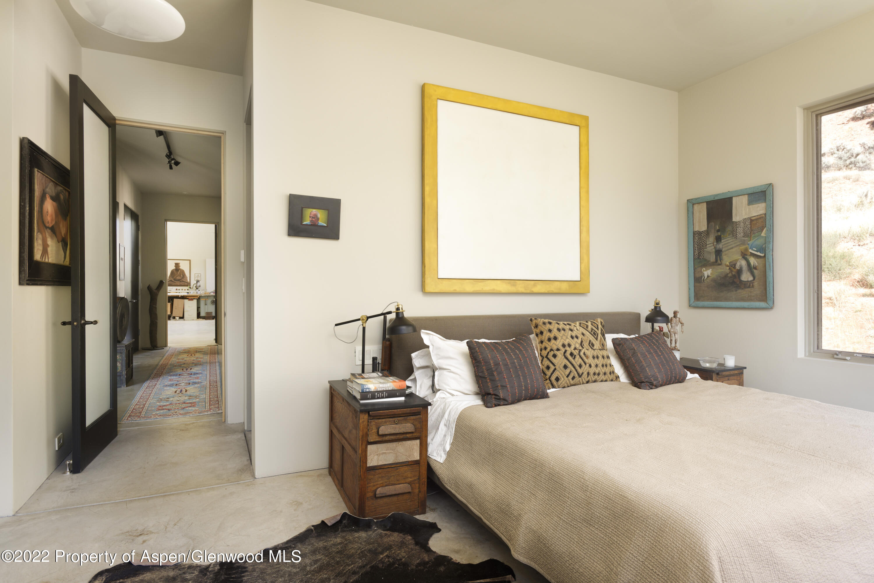 202 Castle View Drive Basalt, CO 81621 - Photo 12 of 29 a bedroom with a bed and wooden floor