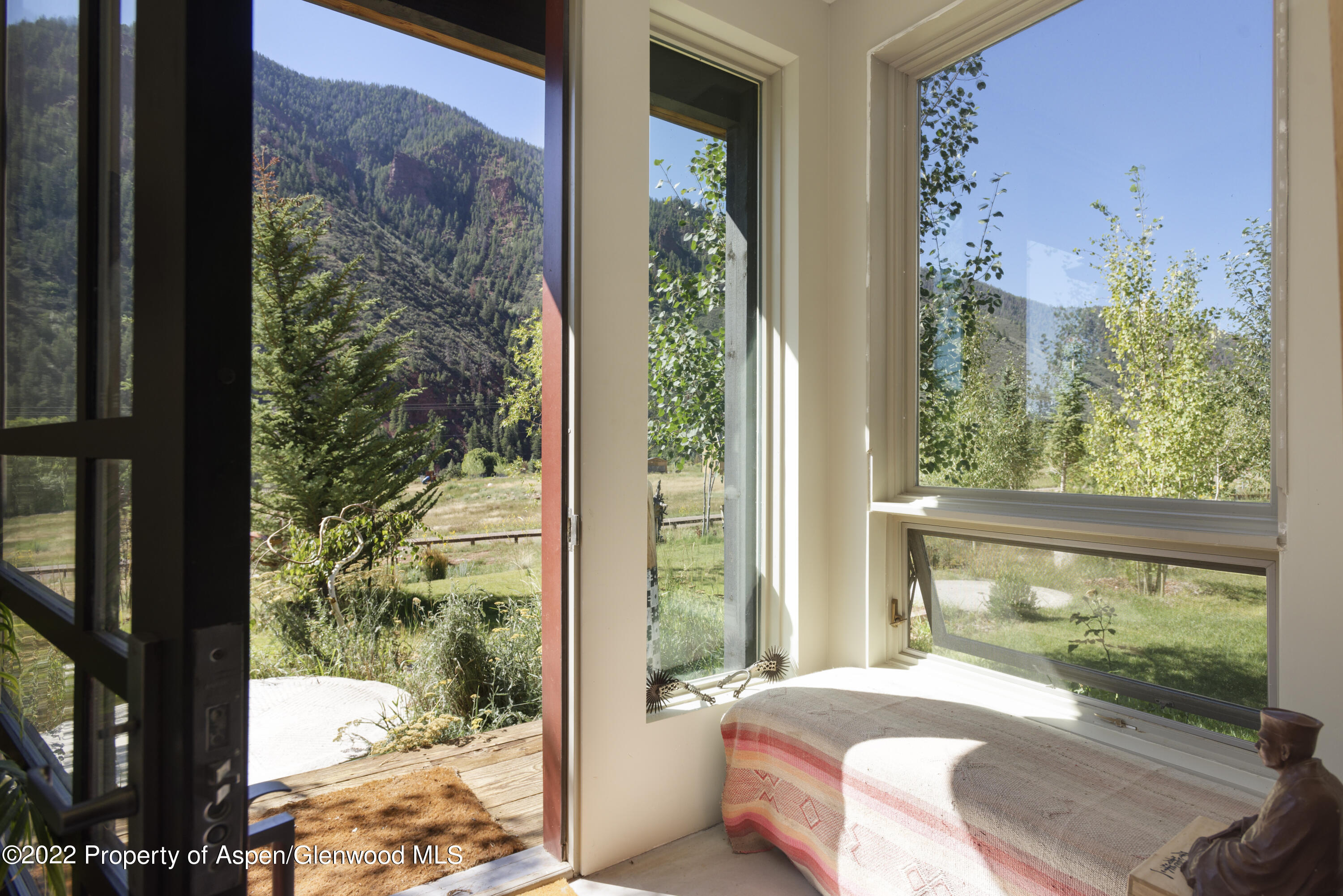 202 Castle View Drive Basalt, CO 81621 - Photo 17 of 29 a bedroom with a bed and a window