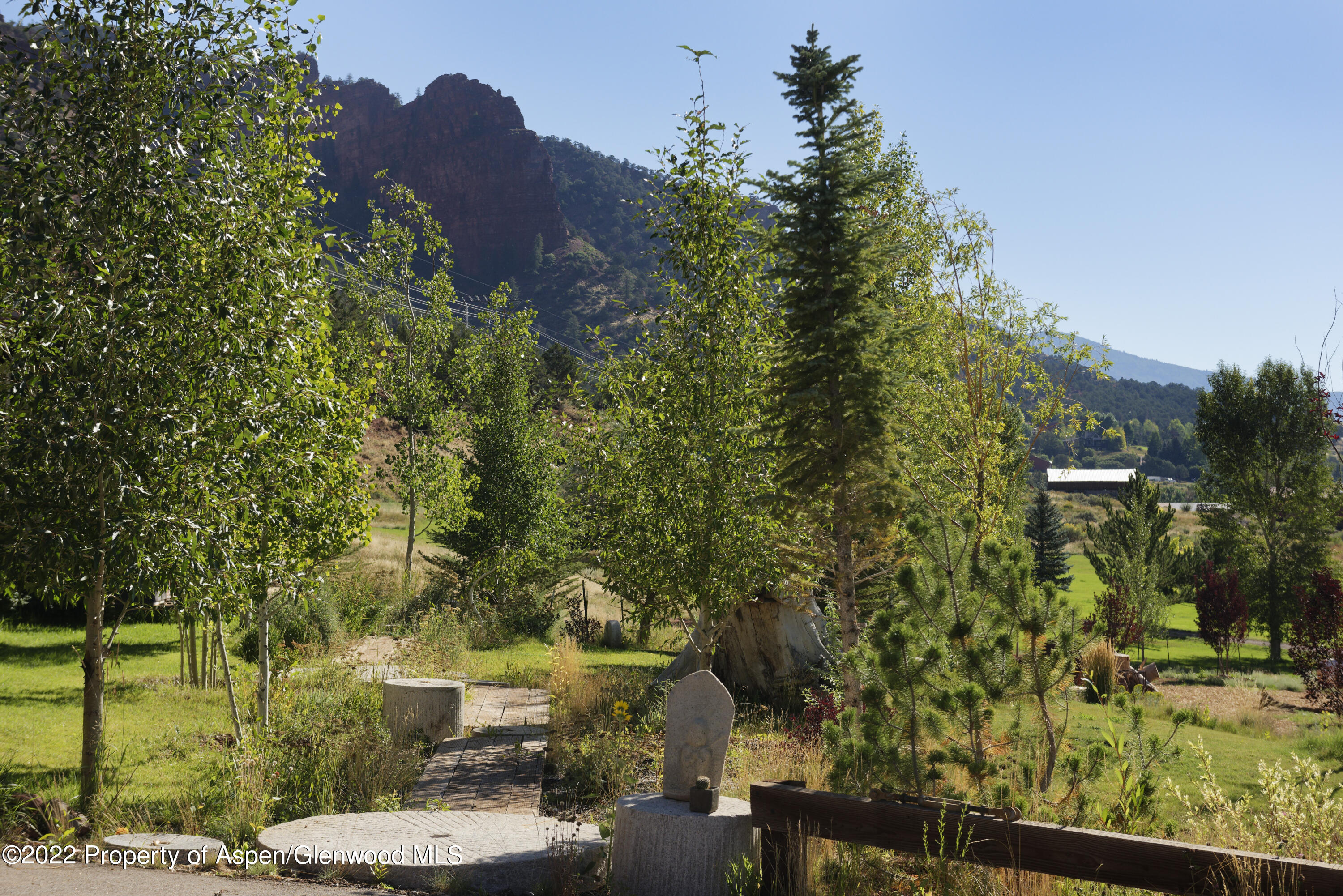 202 Castle View Drive Basalt, CO 81621 - Photo 21 of 29 a view of backyard with outdoor seating and green space