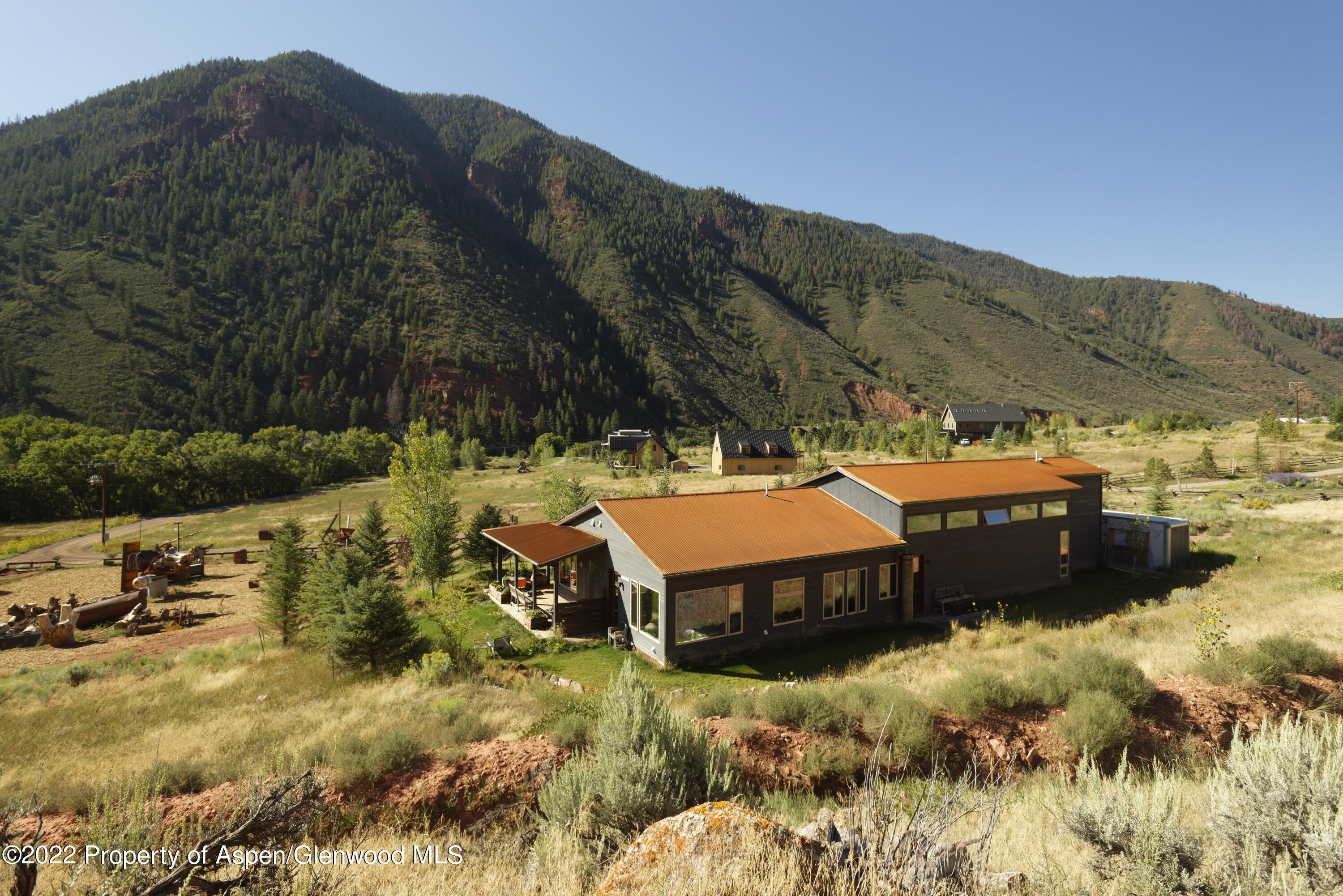 202 Castle View Drive Basalt, CO 81621 - Photo 4 of 29 a view of a big yard with mountains in the background