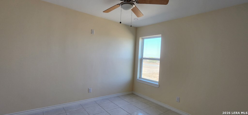 118 Grass Valley Road, Unit 208 Eagle Pass, TX 78852 - Photo 7 of 28 an empty room with a window and a fan