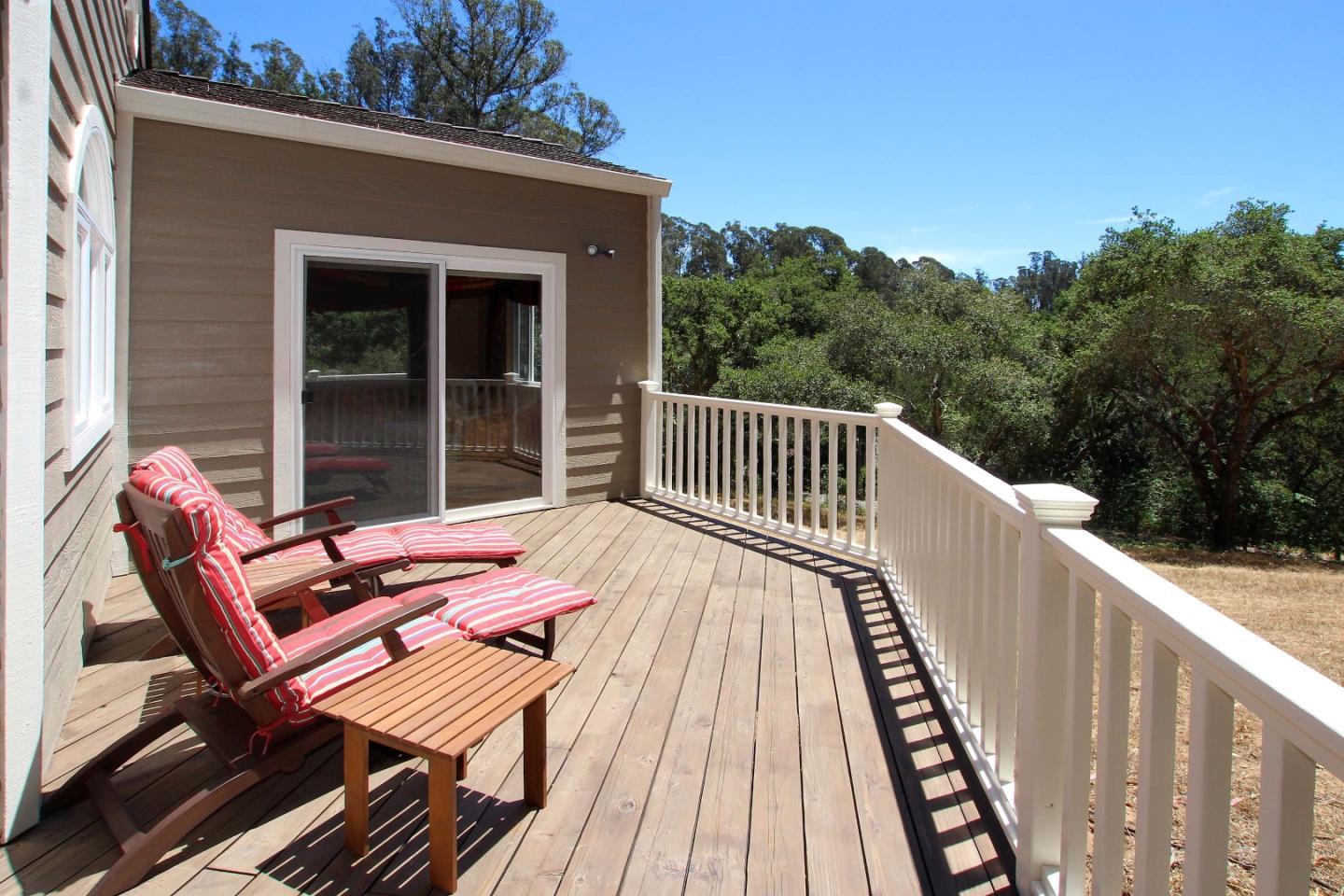 213 Gillette Road Watsonville, CA 95076 - Photo 15 of 27 a view of balcony with wooden floor and outdoor seating