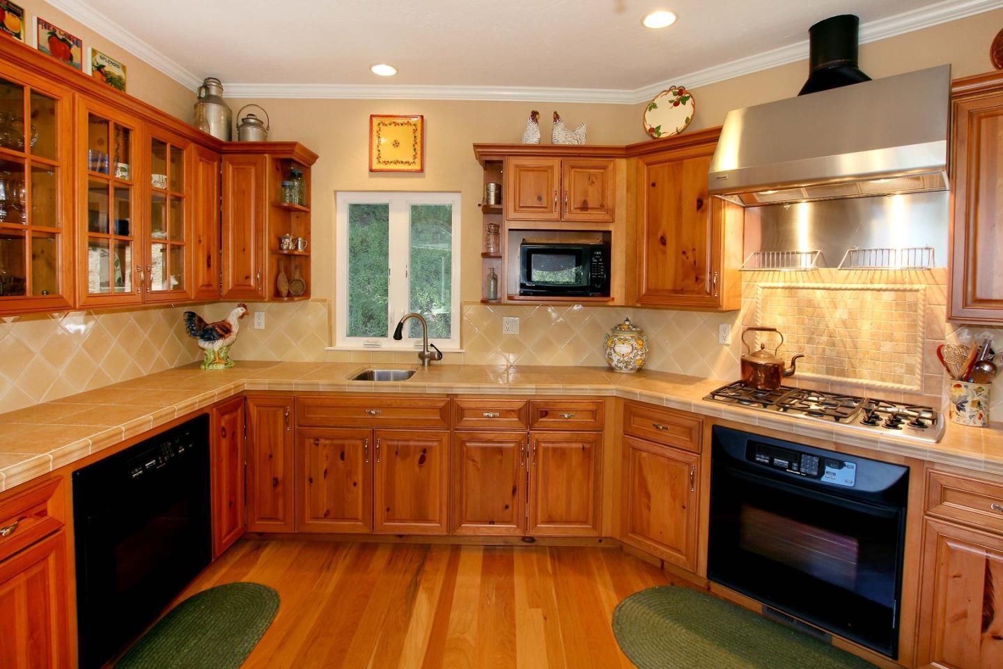 213 Gillette Road Watsonville, CA 95076 - Photo 20 of 27 a kitchen with stainless steel appliances granite countertop a stove and a sink