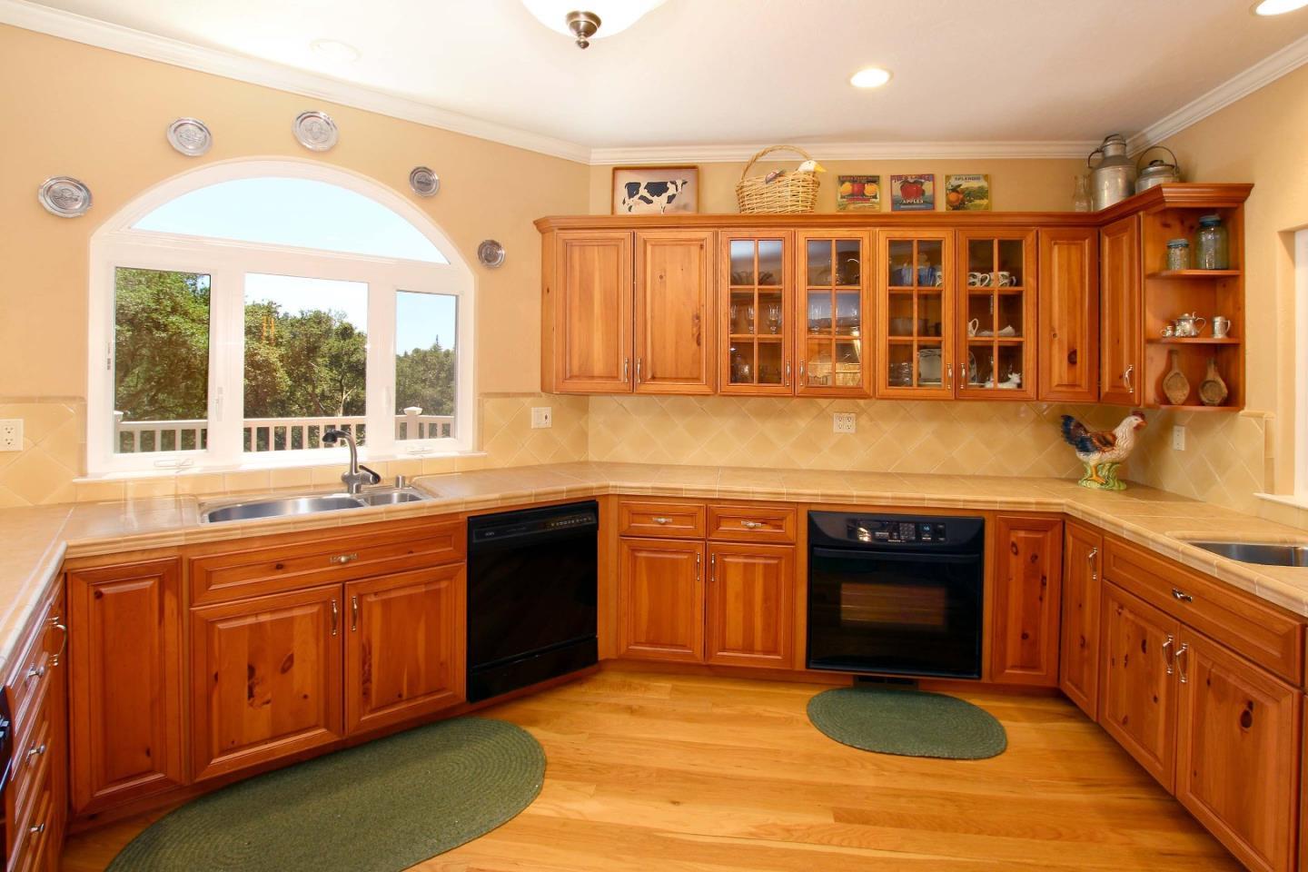 213 Gillette Road Watsonville, CA 95076 - Photo 22 of 27 a kitchen with stainless steel appliances granite countertop a sink and cabinets